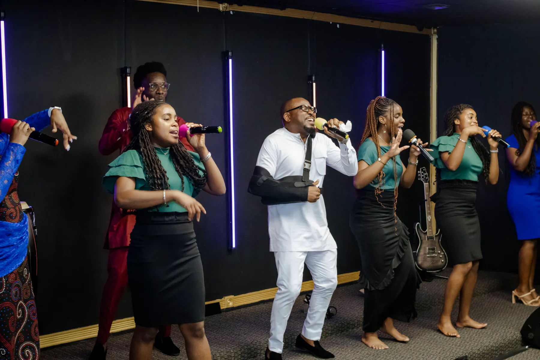 The Victory House praise team worshipping together
