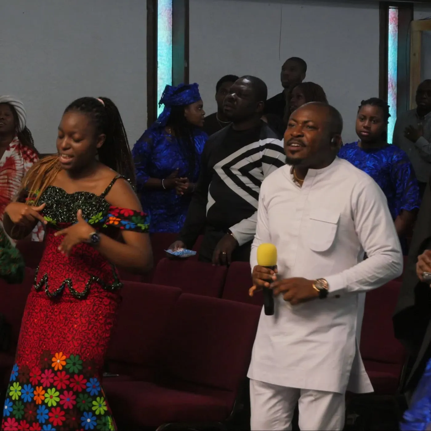 Victory House members worshipping together during a church gathering