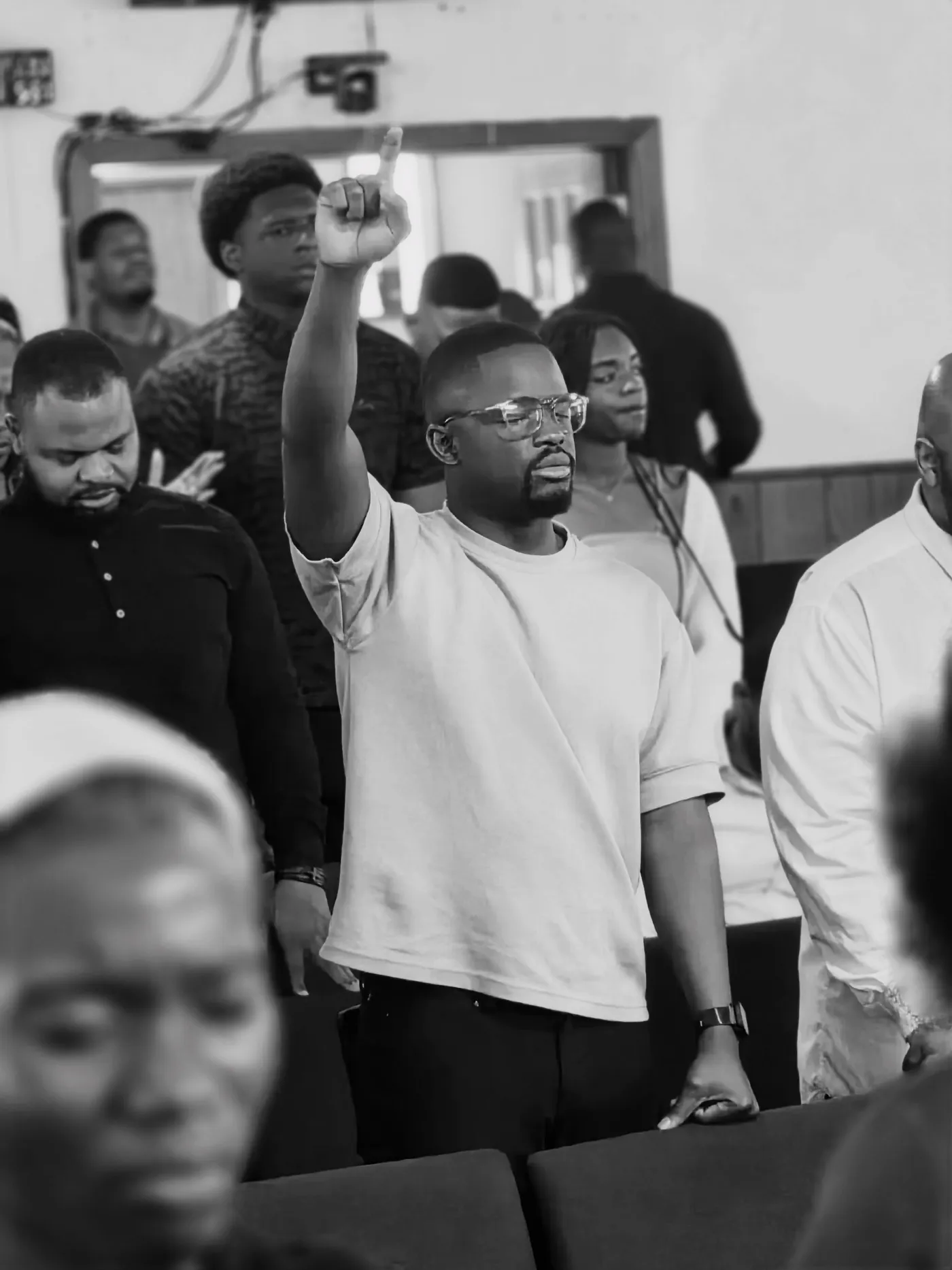 Victory House members praying together