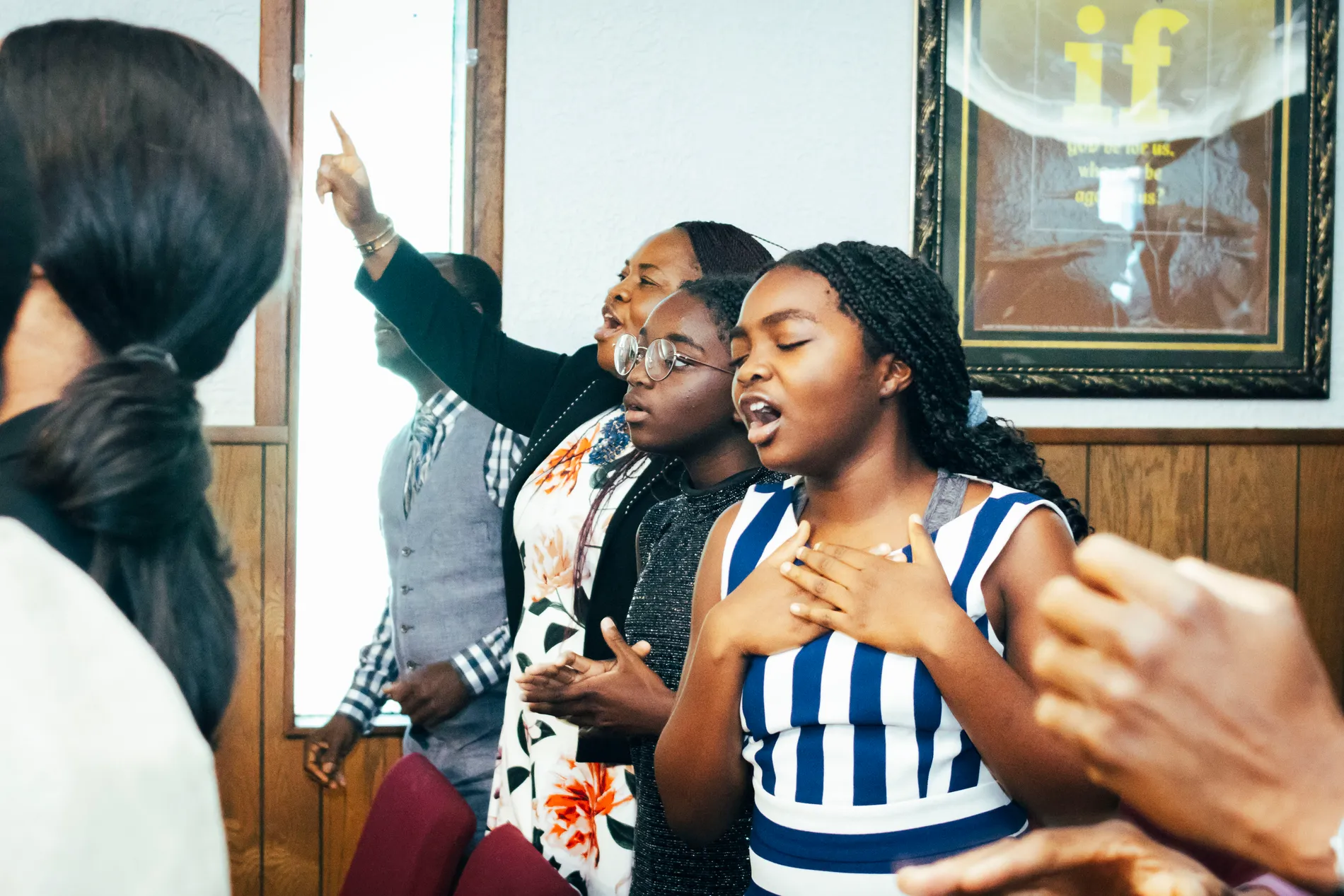 Victory House members worshipping together