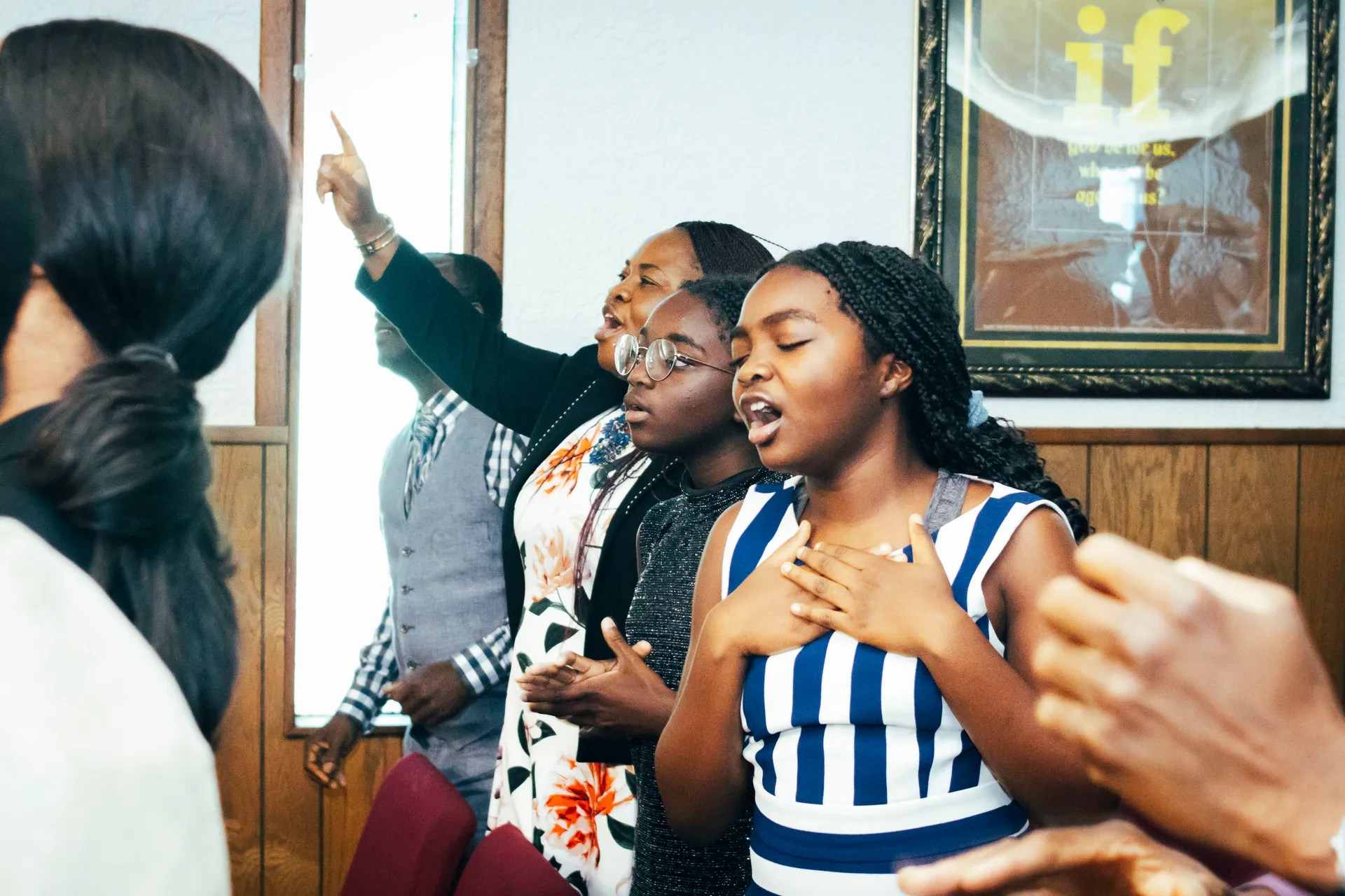 Victory House members singing during worship