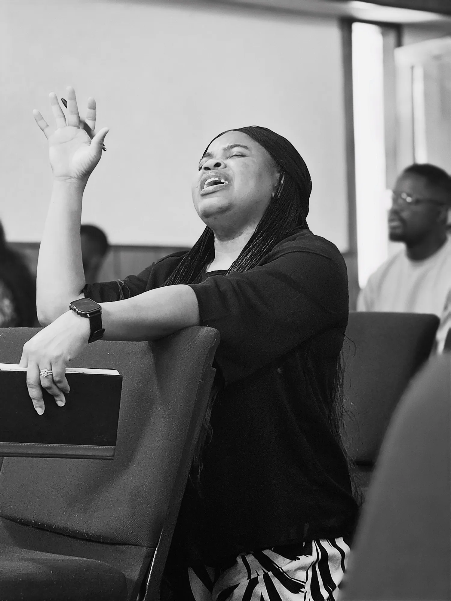 A Victory House member in prayer